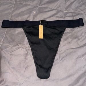 SKIMS COTTON RIBBED THONG ‘SOOT’
